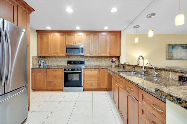 4339 Bowling Green Cir Unit 19, Sarasota, FL 34233 - kitchen featuring appliances with stainless steel finishes, backsplash, dark stone counters, light tile patterned floors, and recessed lighting