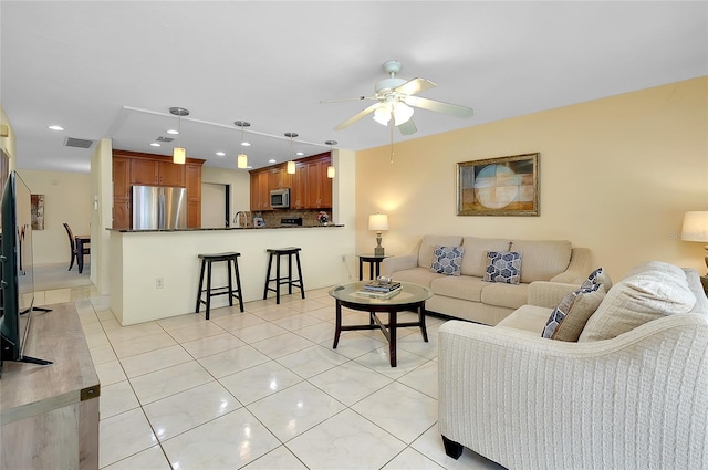 4339 Bowling Green Cir Unit 19, Sarasota, FL 34233 - living room featuring light tile patterned flooring, ceiling fan, and recessed lighting
