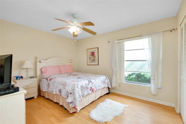 4339 Bowling Green Cir Unit 19, Sarasota, FL 34233 - bedroom with light wood-type flooring, a closet, and a ceiling fan