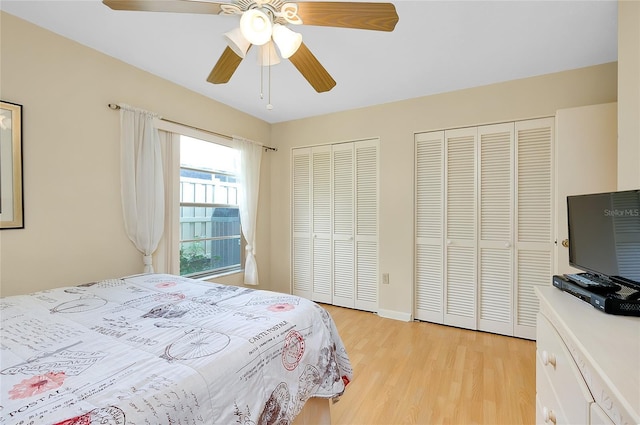4339 Bowling Green Cir Unit 19, Sarasota, FL 34233 - bedroom with multiple closets, light wood-type flooring, and ceiling fan