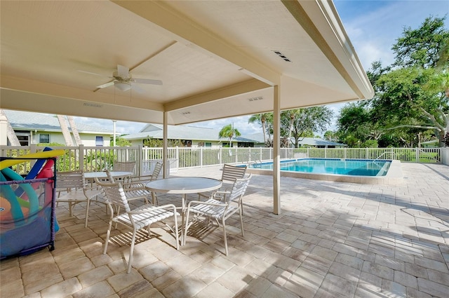 4339 Bowling Green Cir Unit 19, Sarasota, FL 34233 - view of patio / terrace with ceiling fan and a community pool