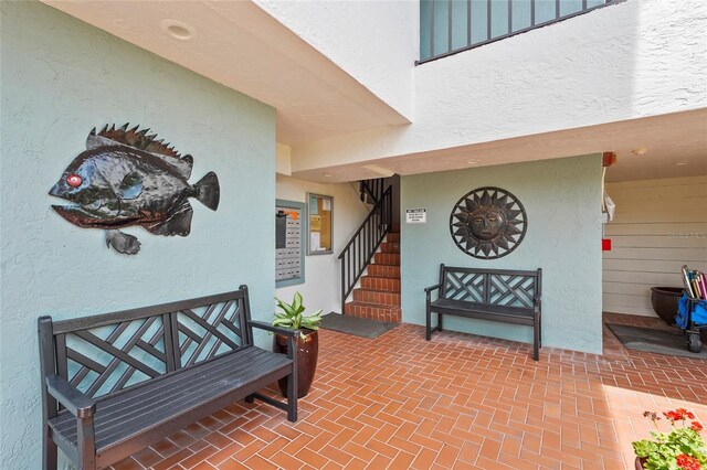 3705 E Bay Dr Unit 205, Holmes Beach, FL 34217 - view of exterior entry with stucco siding