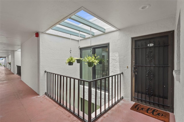 3705 E Bay Dr Unit 205, Holmes Beach, FL 34217 - doorway to property with stucco siding