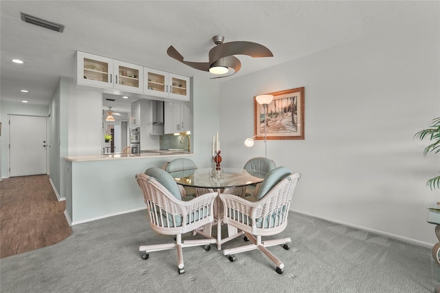 3705 E Bay Dr Unit 205, Holmes Beach, FL 34217 - carpeted dining room featuring a ceiling fan and recessed lighting