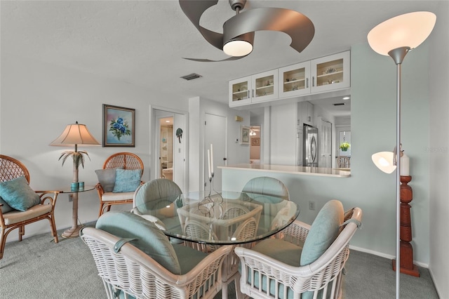 3705 E Bay Dr Unit 205, Holmes Beach, FL 34217 - dining room featuring carpet and baseboards