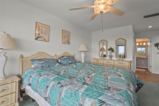 3705 E Bay Dr Unit 205, Holmes Beach, FL 34217 - bedroom featuring wood finished floors, ceiling fan, and recessed lighting