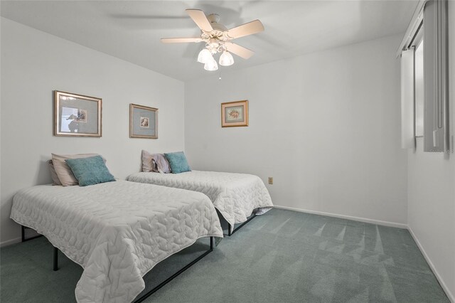 3705 E Bay Dr Unit 205, Holmes Beach, FL 34217 - carpeted bedroom with baseboards and a ceiling fan