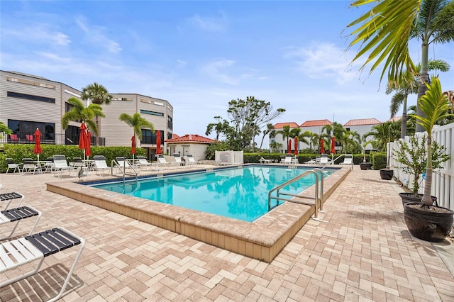 3705 E Bay Dr Unit 205, Holmes Beach, FL 34217 - community pool featuring a patio area