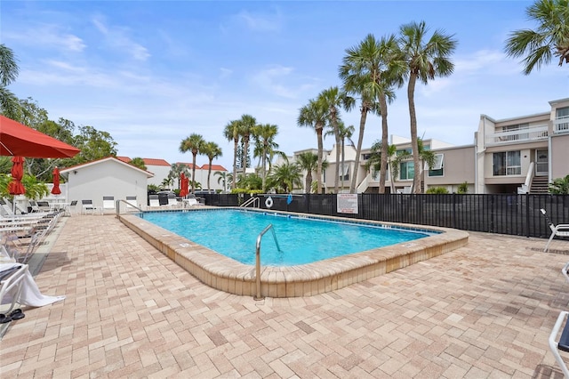 3705 E Bay Dr Unit 205, Holmes Beach, FL 34217 - community pool with a residential view and a patio