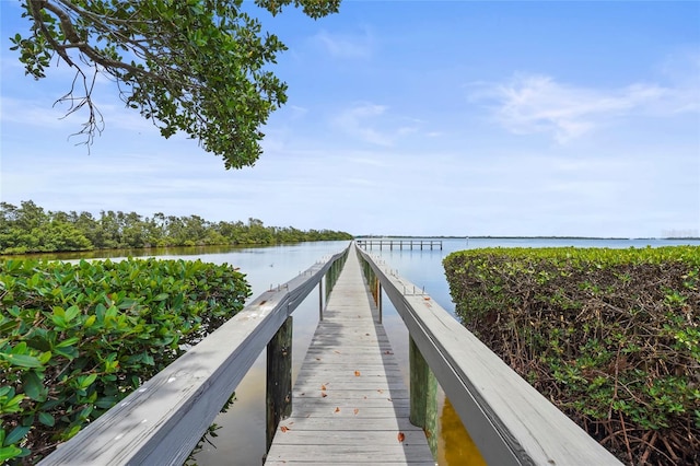 3705 E Bay Dr Unit 205, Holmes Beach, FL 34217 - dock featuring a water view