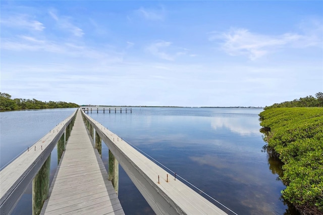 3705 E Bay Dr Unit 205, Holmes Beach, FL 34217 - dock featuring a water view