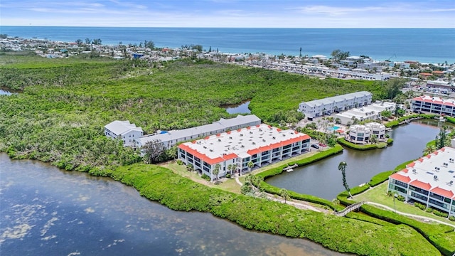 3705 E Bay Dr Unit 205, Holmes Beach, FL 34217 - drone / aerial view of a large body of water and apartment complex
