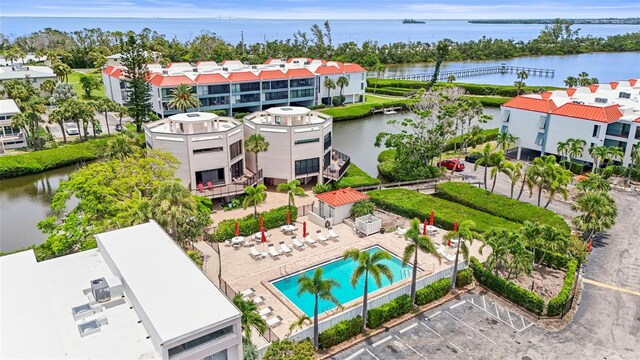 3705 E Bay Dr Unit 205, Holmes Beach, FL 34217 - aerial view of a large body of water and a pool area