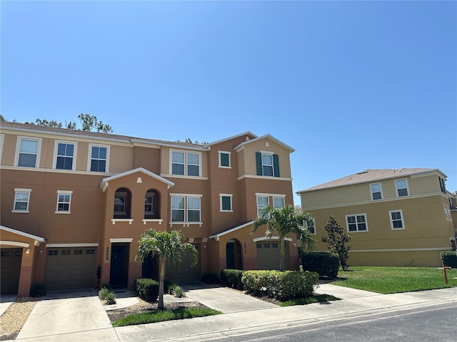 8809 White Sage Loop, Lakewood Ranch, FL 34202 - multi unit property with stucco siding, a garage, and driveway