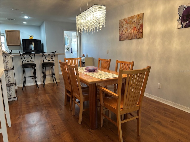 8809 White Sage Loop, Lakewood Ranch, FL 34202 - dining space featuring dark wood finished floors, a chandelier, and recessed lighting