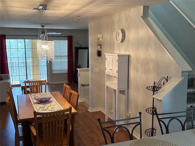 8809 White Sage Loop, Lakewood Ranch, FL 34202 - dining space featuring wood finished floors and a chandelier