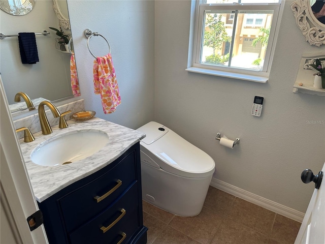8809 White Sage Loop, Lakewood Ranch, FL 34202 - half bathroom featuring vanity and tile patterned flooring