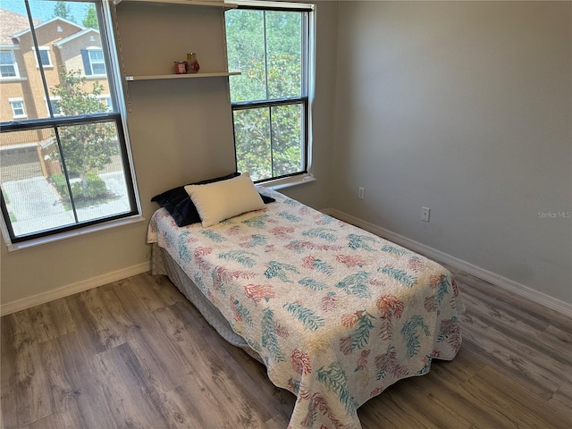 8809 White Sage Loop, Lakewood Ranch, FL 34202 - bedroom featuring baseboards and wood finished floors