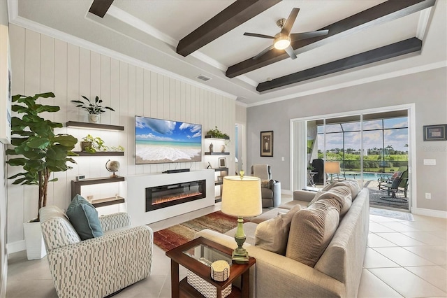 10347 Coastal Shores Dr, Parrish, FL 34219 - living room featuring beam ceiling, light tile patterned floors, ornamental molding, ceiling fan, and a glass covered fireplace