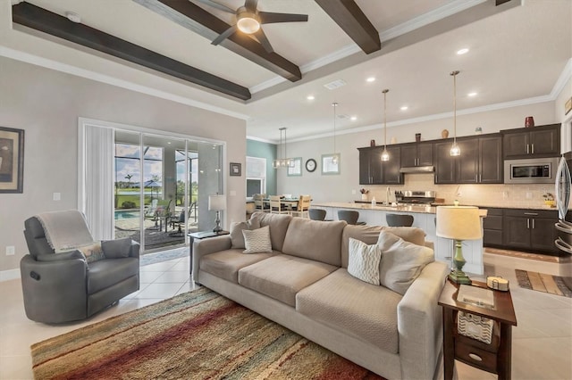 10347 Coastal Shores Dr, Parrish, FL 34219 - living room with light tile patterned floors, ornamental molding, a ceiling fan, beam ceiling, and recessed lighting