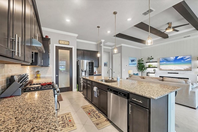 10347 Coastal Shores Dr, Parrish, FL 34219 - kitchen with appliances with stainless steel finishes, open floor plan, decorative backsplash, light tile patterned floors, and under cabinet range hood