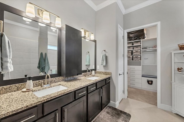 10347 Coastal Shores Dr, Parrish, FL 34219 - full bath with crown molding, double vanity, and a spacious closet