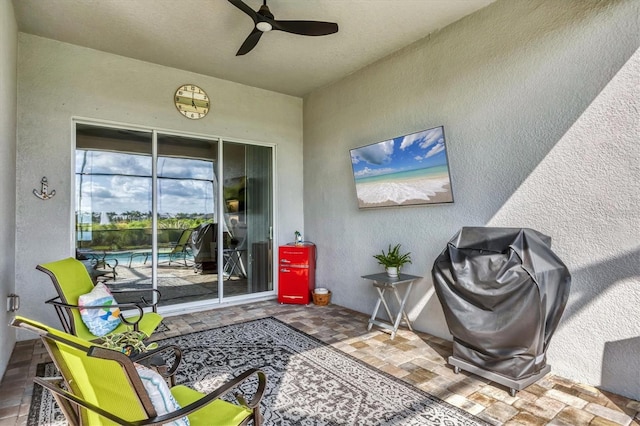 10347 Coastal Shores Dr, Parrish, FL 34219 - doorway to property with a ceiling fan, stucco siding, a patio area, and an outdoor pool