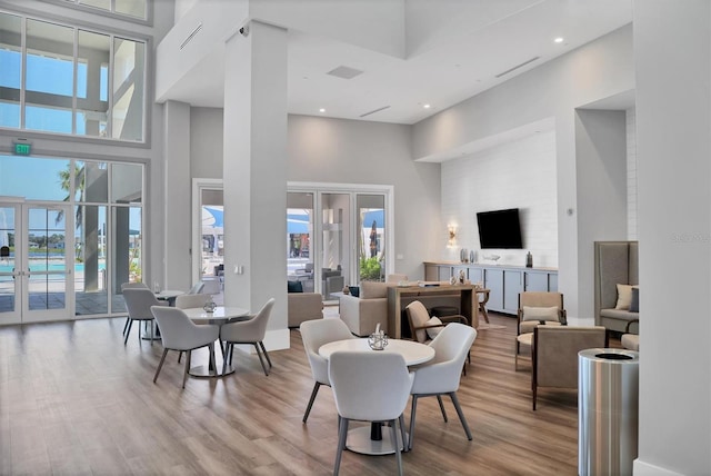 10347 Coastal Shores Dr, Parrish, FL 34219 - dining area with a high ceiling, wood finished floors, healthy amount of natural light, french doors, and recessed lighting