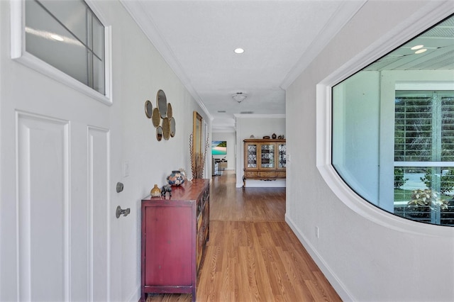 6962 Belgrave Dr, Sarasota, FL 34242 - corridor featuring crown molding, light wood finished floors, and recessed lighting
