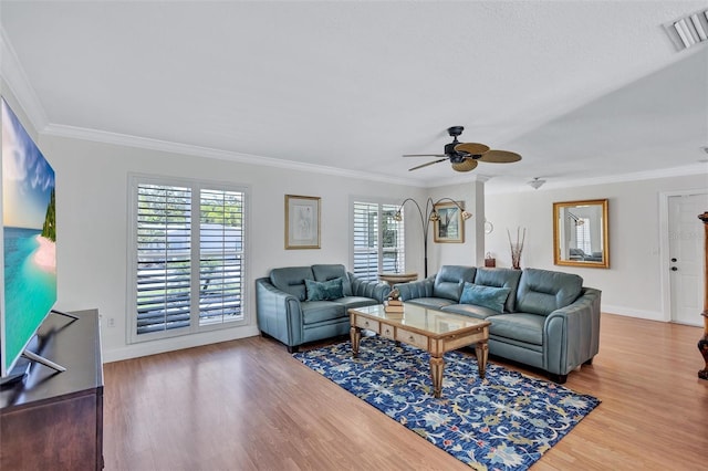 6962 Belgrave Dr, Sarasota, FL 34242 - living room with ornamental molding, wood finished floors, and ceiling fan