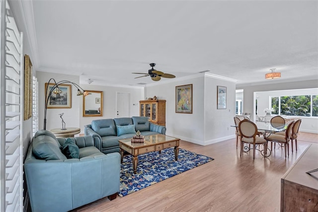 6962 Belgrave Dr, Sarasota, FL 34242 - living area with crown molding, wood finished floors, and a ceiling fan