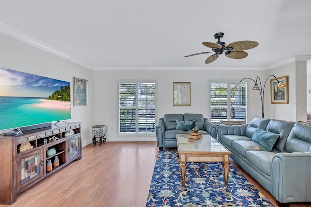 6962 Belgrave Dr, Sarasota, FL 34242 - living room featuring ornamental molding, plenty of natural light, wood finished floors, and ceiling fan