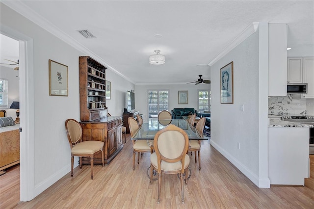 6962 Belgrave Dr, Sarasota, FL 34242 - dining area with a ceiling fan, light wood-type flooring, and crown molding