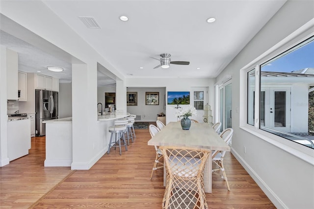6962 Belgrave Dr, Sarasota, FL 34242 - dining room featuring a ceiling fan, light wood-style floors, and recessed lighting