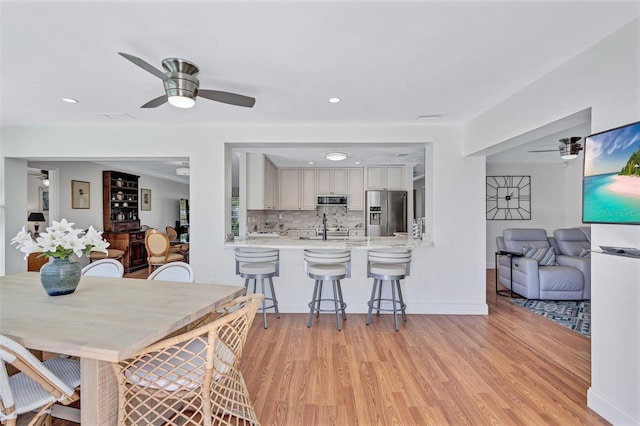 6962 Belgrave Dr, Sarasota, FL 34242 - dining space with a ceiling fan, light wood finished floors, and recessed lighting
