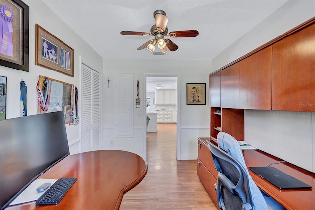 6962 Belgrave Dr, Sarasota, FL 34242 - office with ceiling fan and light wood-style floors