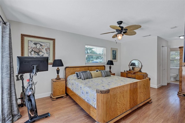 6962 Belgrave Dr, Sarasota, FL 34242 - bedroom with light wood-style floors, a ceiling fan, and connected bathroom