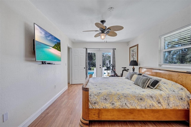 6962 Belgrave Dr, Sarasota, FL 34242 - bedroom with french doors, access to exterior, light wood-style flooring, and a ceiling fan