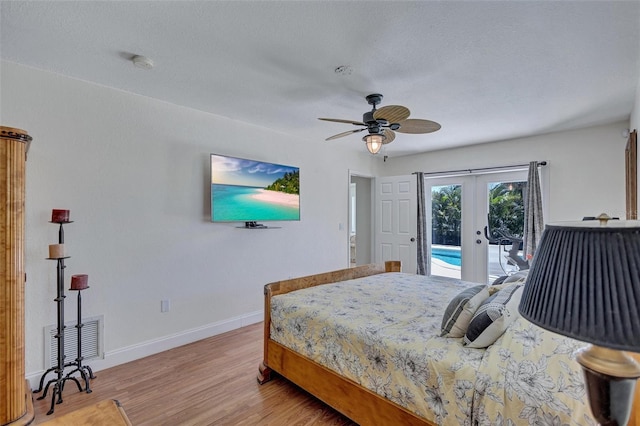 6962 Belgrave Dr, Sarasota, FL 34242 - bedroom featuring french doors, access to exterior, light wood-style floors, and ceiling fan