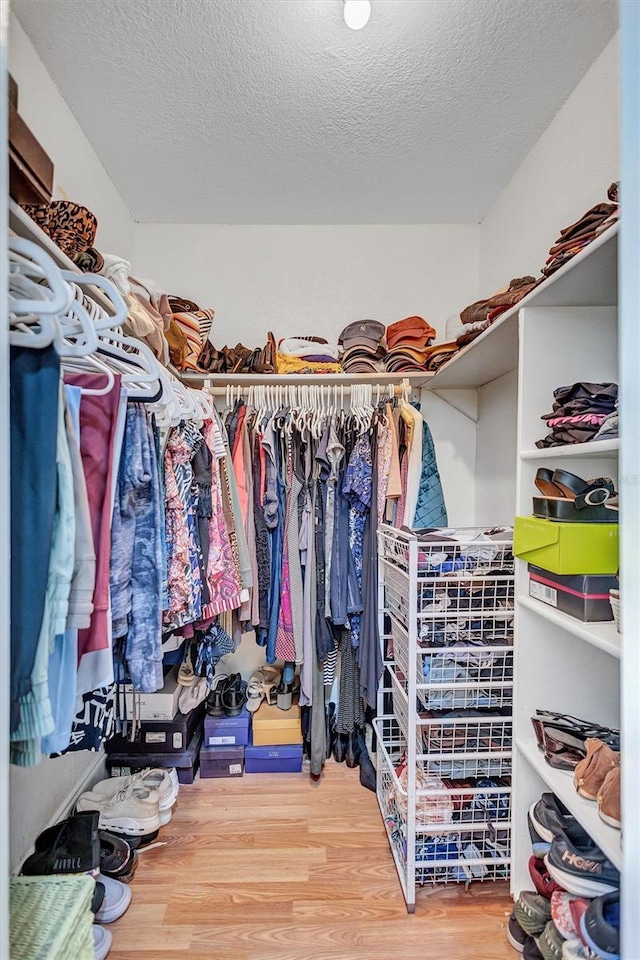 6962 Belgrave Dr, Sarasota, FL 34242 - walk in closet with wood finished floors