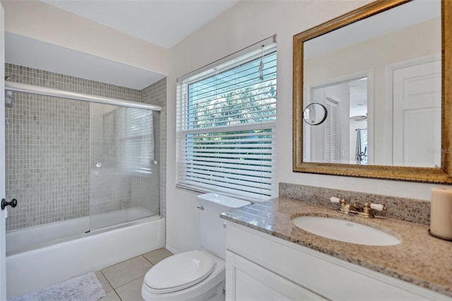 6962 Belgrave Dr, Sarasota, FL 34242 - full bathroom featuring vanity, tile patterned floors, and combined bath / shower with glass door