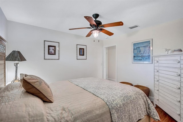 6962 Belgrave Dr, Sarasota, FL 34242 - bedroom with wood finished floors and ceiling fan