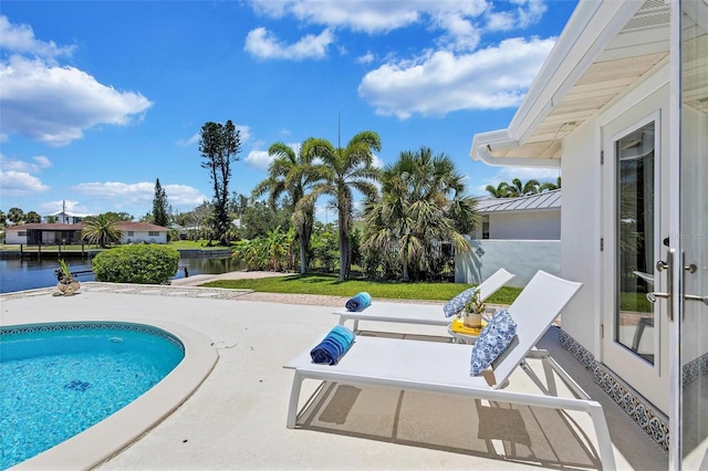 6962 Belgrave Dr, Sarasota, FL 34242 - swimming pool featuring a water view and a patio area