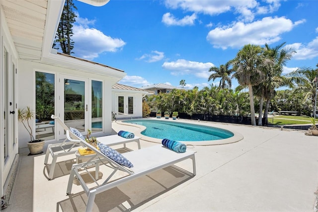 6962 Belgrave Dr, Sarasota, FL 34242 - outdoor pool featuring french doors and a patio