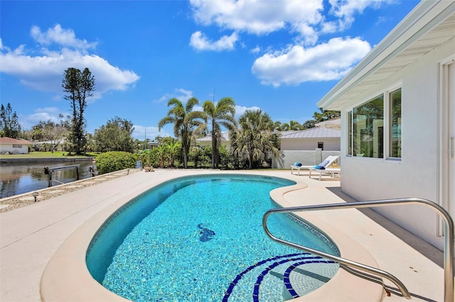 6962 Belgrave Dr, Sarasota, FL 34242 - outdoor pool with a patio area and a water view