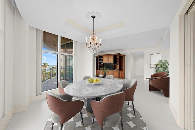 2251 Gulf Of Mexico Dr Unit 301, Longboat Key, FL 34228 - dining area with a chandelier and a tray ceiling