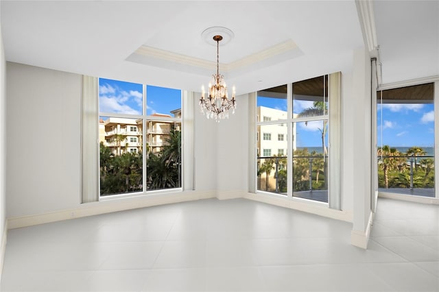 2251 Gulf Of Mexico Dr Unit 301, Longboat Key, FL 34228 - unfurnished room with a chandelier and a tray ceiling