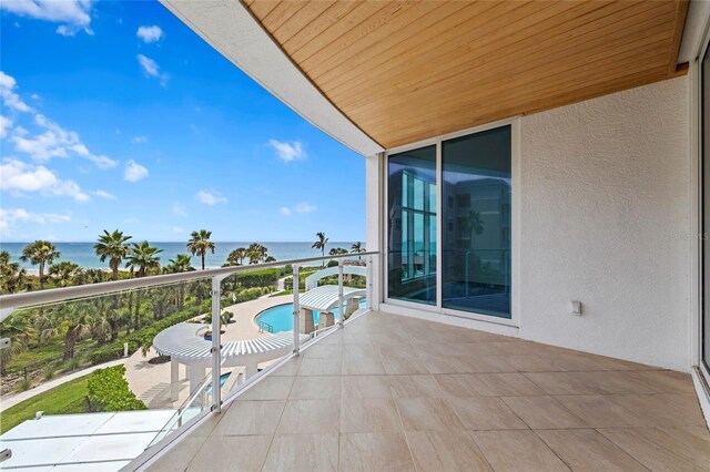 2251 Gulf Of Mexico Dr Unit 301, Longboat Key, FL 34228 - balcony with a water view and view of pool