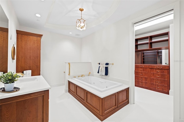 2251 Gulf Of Mexico Dr Unit 301, Longboat Key, FL 34228 - full bath with a tub with jets, vanity, a chandelier, recessed lighting, and a raised ceiling