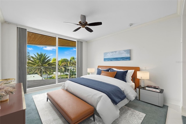 2251 Gulf Of Mexico Dr Unit 301, Longboat Key, FL 34228 - bedroom featuring access to exterior, ornamental molding, ceiling fan, and floor to ceiling windows